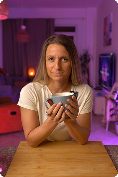 Alex, a women's wellness coach, enjoying a calming evening tea as part of her healthy lifestyle routine